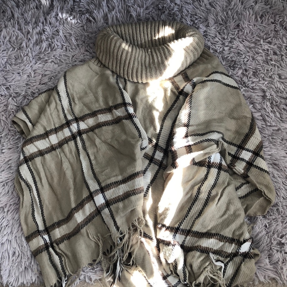 Woman’s plaid poncho